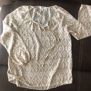 Sheer beige and white top.